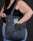 Everyday Tote in Black Magic Waters worn over shoulder of model