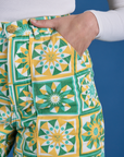 Close up of Alex's hand in the front pocket of Longline Work Shorts in Spring Quilt Print