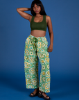 Kandia is 5’3” and wearing XS Drop Pocket Cargo Pants in Spring Quilt Print paired with evergreen Mini Tank