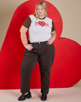 Juliet is 5’7” and wearing L Vintage Tee in Love Big Bud paired with fudgesicle brown Work Pants
