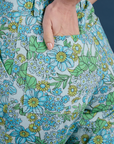 Close up of Madeline's hand in the back pocket of Winter Floral Print Work Pants