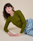 Long Sleeve Baby Tee in Summer Olive worn by Alex
