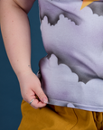 Ashley is holding the hem of Airbrush Star Vintage Tee