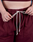 Close up of Ashley pulling the cotton drawstring cord