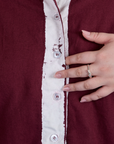 Close up of button placket of Painted Pantry Button-Up in Red Wine on Ashley