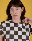 Checker Organic Tee in Espresso Brown front close up on Alex