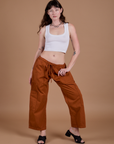 Alex is wearing Drop Pocket Cargo Pants in Burnt Terracotta and Cropped Tank in Vintage Tee White