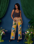 Kandia is 5'3" and wearing XS Paintstamped Work Pants in Froggy paired with espresso brown Cropped Tank
