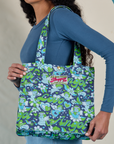 Angel Printed Shopper Tote worn on model's shoulder