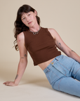 Alex is wearing Muscle Tee in Fudgesicle Brown
