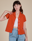 Alex is 5’8” and wearing P Pantry Button-Up in Chili Red