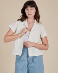 Alex is 5’8” and wearing P Pantry Button-Up in Vintage Tee White