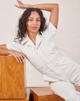 Blair is wearing Petite Short Sleeve Jumpsuit in Vintage Tee Off-White