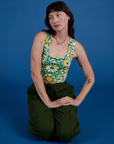 Cropped Tank Top in Spring Quilt Print and evergreen Drop Pocket Cargo Pants on Alex
