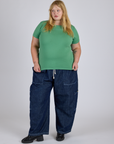 Juliet is 5’7” and wearing L Jr. Varsity Tee in Seafoam Green paired with dark wash Denim Drop Pocket Pants