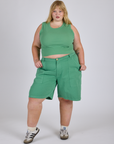 Juliet is 5’7” and wearing 2XL Longline Work Shorts in Seafoam Green with matching Muscle Tee