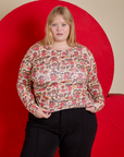 Juliet is 5’7” and wearing L Long Sleeve Baby Tee in Hot Stuff Print