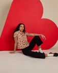 Hot Stuff Print Pantry Button-Up and black Work Pants worn by Shahana