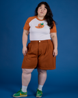 Ashley is wearing Produce Raglan Tee in Habanero