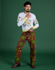 Jesse is wearing Floral Painted Work Pants in Brown and Floral Long Sleeve Baby Tee in Yellow