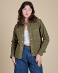 Alex is 5'8" and wearing P Denim Work Jacket in Surplus Green