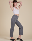 Side view of Work Pants in Washed Grey and Cropped Tank in Vintage Tee White on Alex