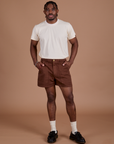 Isaac is 5’10” and wearing M Classic Work Shorts in Fudgesicle Brown paired with Organic Vintage Tee in Vintage Off White