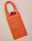 Phone tucked into construction orange Cell Phone Tote