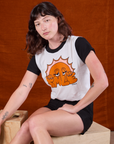 Alex is wearing Anniversary Tee in Smile and black Work Shorts