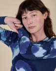 Long Sleeve Baby Tee in Blue Magic Waters front close up on Alex