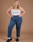 Juliet is 5'8" and wearing 1XL Organic Work Pants in French Blue paired with vintage tee white Cropped Tank