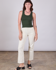 Alex is wearing Tank Top in Swamp Green and vintage tee off-white Work Pants