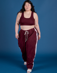 Ashley is wearing Painted Drop Pocket Cargo Pants in Red Wine and Mini Tank in Red Wine