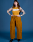 Sydney is wearing Painted Muscle Tee in Mustard Yellow and spicy mustard Drop Pocket Cargo Pants