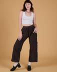 Alex is 5’8” and wearing XXS Corduroy Drop Pocket Cargo Pants in Espresso Brown paired with a Cropped Tank in Vintage Tee White