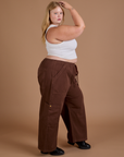 Side view of Drop Pocket Cargo Pants in Fudgesicle Brown and Cropped Tank in vintage tee white