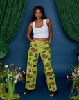 Kandia is wearing Paintstamped Work Pants in Froggy and vintage tee white Cropped tank