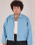Miguel is 6’0” and wearing 1XL Mechanic Jacket in Baby Blue