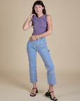 Alex is wearing Muscle Tee in Faded Grape and light wash Carpenter Jeans