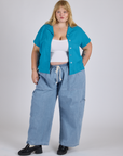 Juliet is 5’7” and wearing L Pantry Button-Up in Hawaiian Blue paired with light wash Denim Drop Pocket Pants