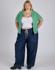 Juliet is 5’7” and wearing L Pantry Button-Up in Seafoam Green paired with dark wash Denim Drop Pocket Pants