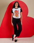Shahana is wearing Vintage Tee in Don't Call Me tucked into black Western Pants