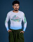 Jesse is 5’7” and wearing S Floral Long Sleeve Baby Tee in Baby Blue