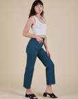 Side view of Work Pants in Lagoon and vintage tee white Cropped Tank on Alex