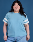 Ashley is 5’7” and wearing L Painted Burly Tee in Baby Blue