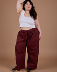 Ashley is wearing Drop Pocket Cargo Pants in Red Wine and Cropped Tank in Vintage Tee White