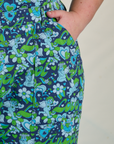 Close up of Juliet's hand in the front pocket of Angel Print Jumpsuit