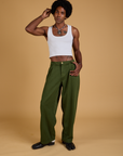 Jerrod is 6'3" and wearing M Baggy Mid-Rise Trousers in Evergreen
