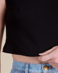 Close up of Muscle Tee in Basic Black bottom hem on Alex