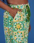 Close up of Kandia's hand in the front pocket of Drop Pocket Cargo Pants in Spring Quilt Print